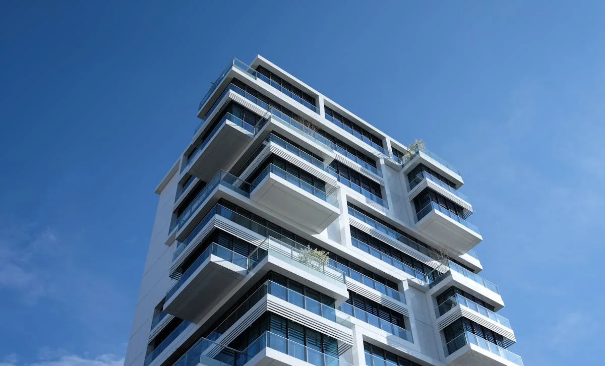 Modern commercial building exterior representing strata and multi-unit mould management services